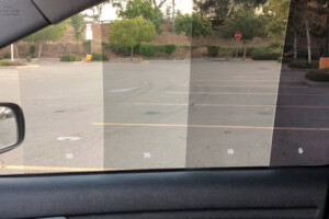 Car window displaying different tint shades