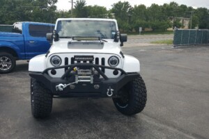 Jeep wrangler with lift kit, wheels, tires, light bars, front bumper and winch
