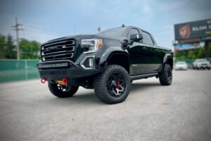2021 GMC Sierra AT4 with a lift kit, wheels, tires front bumper and light bar